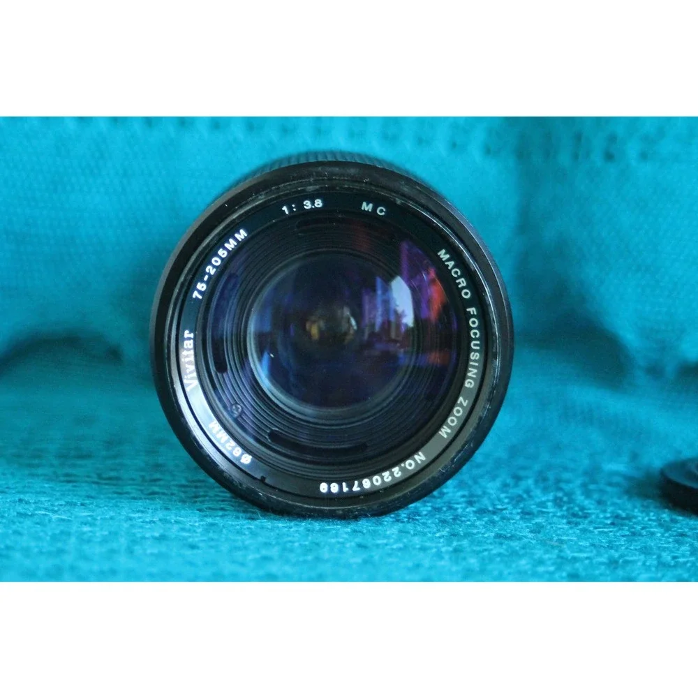 Vivitar 75-205 MM F1:3.8 Lens for Minolta MC mount with 2x converter.